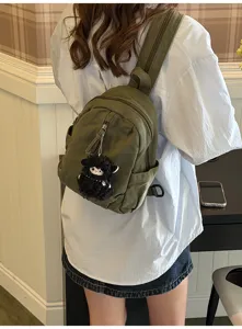 Vintage gewaschener Canvas Mini Rucksack Freizeittasche mit schwarzem Plüsch Schaf Anhänger.