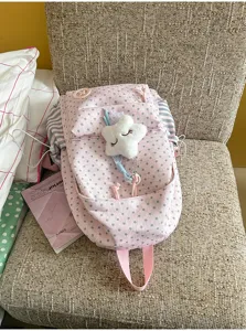 Pink star print school backpack with cute plush star pendant, large capacity for daily use.
