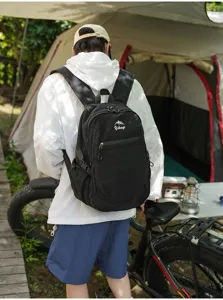 Vue détaillée d'un sac à dos de sport noir d'extérieur dans un environnement de camping