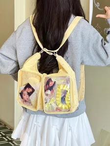 Detailed view of yellow Harajuku style Ita bag with transparent star pattern pockets