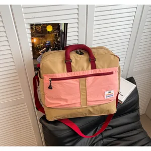 Large capacity color-block outdoor travel bag with durable nylon material and adjustable strap