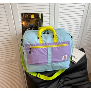 Large capacity travel bag with vibrant blue purple and lime color block design