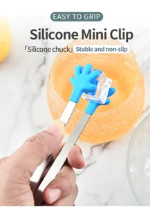 Stainless steel mini ice clip with blue silicone hand grip, perfect for coffee and sugar cubes.