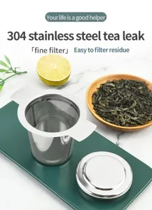 Infuseur à thé en acier inoxydable avec filtre fin et couvercle, idéal pour le thé en vrac.