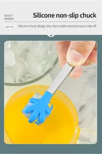 Detail view of mini stainless steel ice tong with blue silicone palm chuck gripping ice cube.