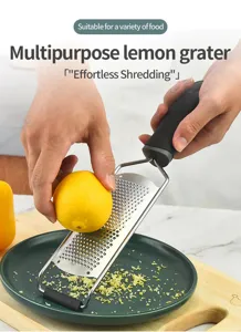 Stainless steel lemon grater cheese grater for kitchen food preparation and citrus zesting.