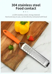 Edelstahl Zitronenreibe und praktische Käsereibe mit orangefarbenem Griff für Küche.