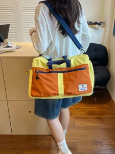Large capacity color-block travel duffle bag for outdoor sports and leisure use