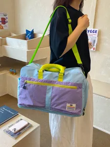 Stylish large capacity color-blocking travel duffel bag with adjustable shoulder strap