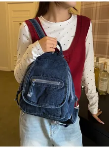 Close-up of a retro washed denim backpack for women in a cozy lifestyle setting