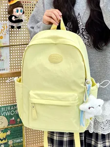 Blassgelber Studentenrucksack mit großer Kapazität und Plüschstern-Anhänger
