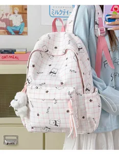 Close-up of a cute pink plaid backpack with bear patterns worn by a student.