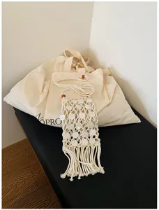 Handmade woven hollow mobile phone bag with long tassels and white shell sequins