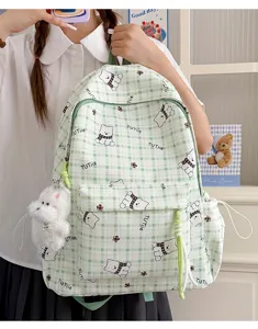 Green plaid student backpack featuring a cute cartoon bear pattern and plush keychain