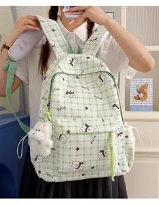 Cute green plaid backpack with cartoon bear patterns worn by a student girl