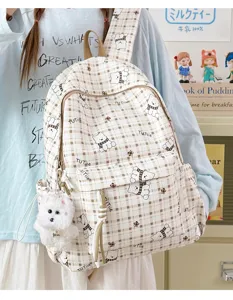 Cute plaid backpack featuring cartoon bear patterns and a fluffy white bear charm for girls