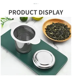 Stainless steel tea infuser detail view, fine mesh strainer with dual handles and lid.