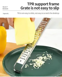 Stainless steel cheese grater detail showing sharp micro blades and anti-slip TPR handle.