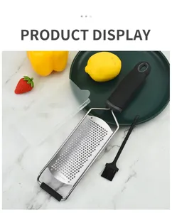 Stainless steel cheese grater with protective cover and cleaning brush for kitchen use.