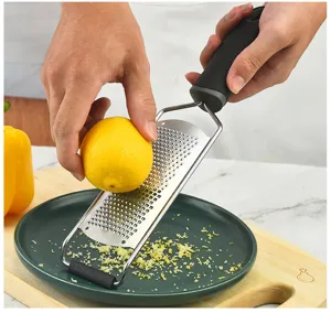 Stainless steel lemon zester and cheese grater detail, with sharp blades and a secure grip.