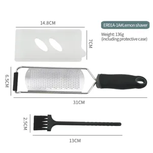 Stainless steel lemon zester and cheese grater set with protective cover and cleaning brush.