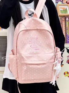 Detailansicht eines rosa Schulrucksacks für Mädchen mit Sternenmuster und Stickerei