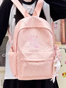 Detailansicht eines rosa Schulrucksacks mit weißem Sternmuster und Stern-Accessoire
