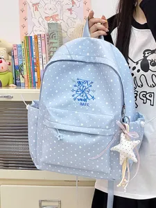 Blauer Schulrucksack mit weißen Sternenmustern und dekorativem Plüschstern-Anhänger