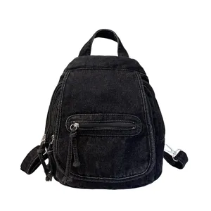 Vintage black washed denim backpack for women featuring multi-pocket design for travel