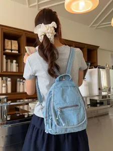 Stylish vintage washed denim backpack for women ideal for travel and daily commuting