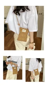 Detailed view of the handmade straw woven hollow knitted crossbody phone bag on model