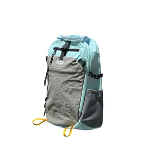 Side detail view of a stylish light blue and grey nylon outdoor travel backpack
