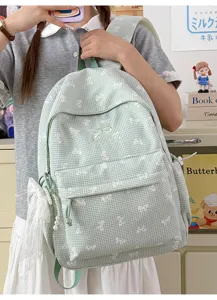Sac à dos scolaire vichy vert avec jolis motifs nœuds blancs et charmante breloque perle