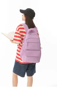 Detailed back view of a purple Japanese school style large capacity backpack on a student