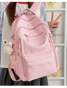 Sac à dos rose pour étudiante avec motifs d'étoiles et charm lapin mignon.