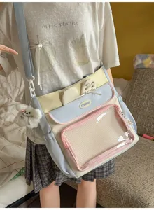 Student wearing a pastel blue and yellow Ita bag with clear window and plush bear