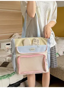 Model holding a cute pastel Japanese style ita bag with bunny ears and mesh pocket
