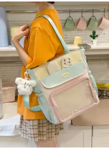 Model carrying a sweet Japanese pastel ita bag with a transparent display pocket