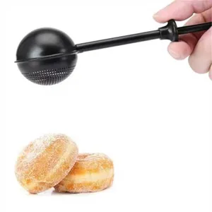 Retractable baking powder duster, black spherical flour sifter kitchen gadget detail view.