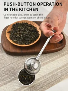 Infuseur à thé en acier inoxydable avec bouton-poussoir, idéal pour le thé en vrac.