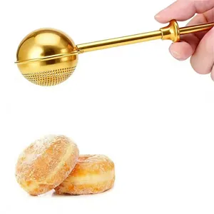 Golden telescopic powder sieve detail shot, stainless steel ball filter for baking kitchen use.