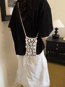 Handmade bohemian woven macrame phone bag with tassels and white shell sequins