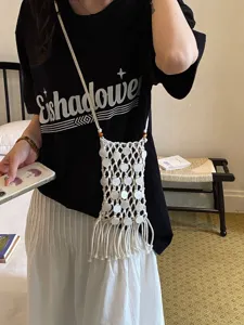 Minimalist handmade woven hollow out phone bag with fringe and shell details for women