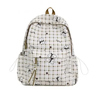 Detail view of cute plaid backpack featuring cartoon bear patterns and multi-pocket design