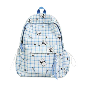 Blue and white plaid student backpack featuring cute cartoon puppy and star patterns