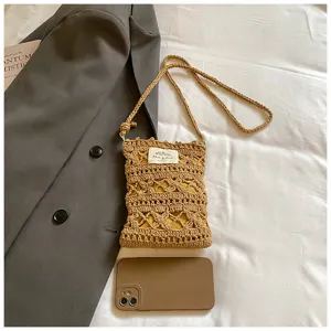 Detailed view of handmade hollow knit texture on a khaki crossbody mobile phone bag