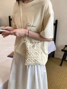 Exquisite handmade cream white crochet phone bag with hollow-out knit and shoulder strap