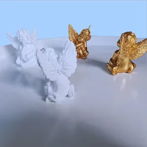 Close-up detail view of cute little angel figurine ornaments for desktop decor photography props.