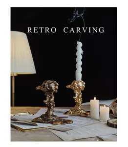 Detailed view of European retro candle holder scene with burning candles and sheet music props.