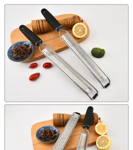 Stainless steel cheese grater kitchen tool lemon zester shredder with ergonomic handle.
